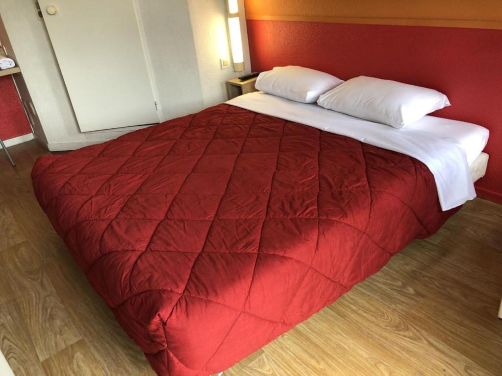 Postel nebo postele na pokoji v ubytování Premiere Classe Laon