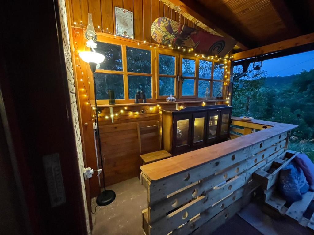 a room with a large window with lights on it at Kokin Brod Apartments in Kokin Brod