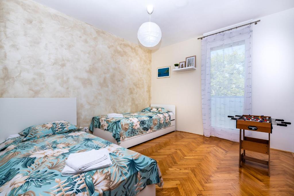 Posteľ alebo postele v izbe v ubytovaní Spacious apartment Rocky with balcony