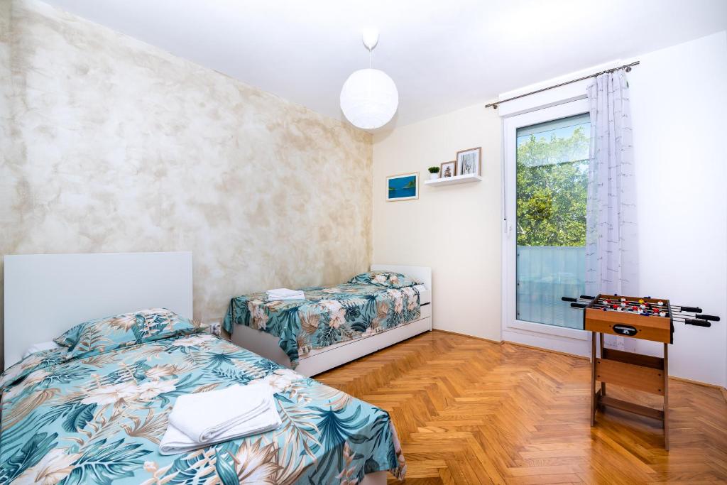 Posteľ alebo postele v izbe v ubytovaní Spacious apartment Rocky with balcony