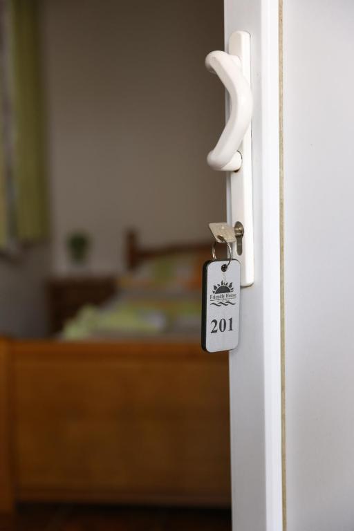 Postel nebo postele na pokoji v ubytování Friendly House