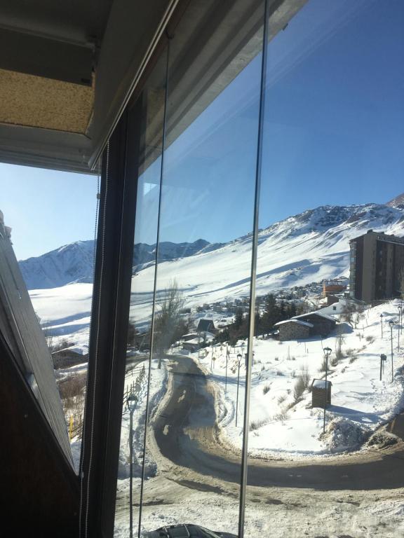 a view of a snow covered mountain from a window at El Colorado 21, Hasparren in El Colorado