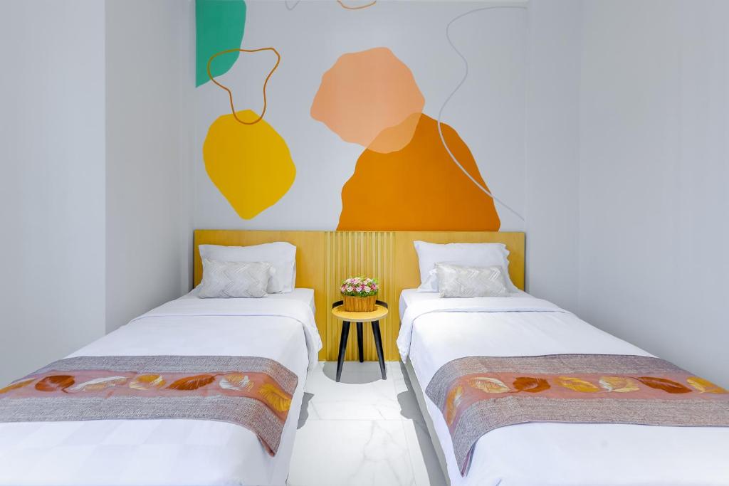Genio Inn - MANTOS tesisinde bir odada yatak veya yataklar