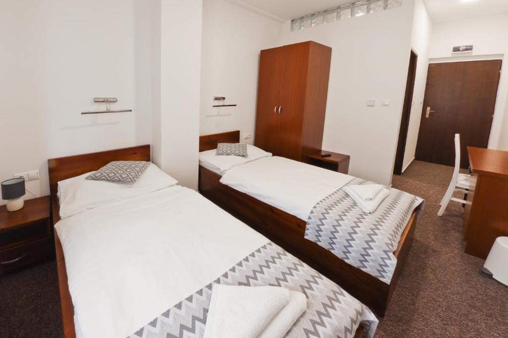 Postel nebo postele na pokoji v ubytování Hotel Slanica