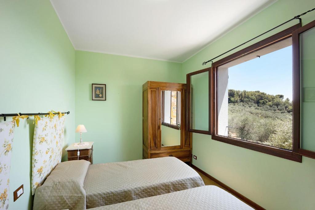 Posteľ alebo postele v izbe v ubytovaní Casale Filiberto Terrazza