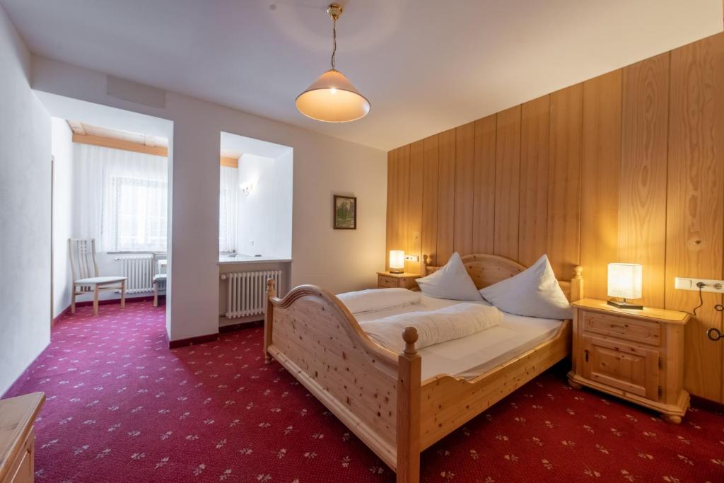 Postel nebo postele na pokoji v ubytování Hotel Stilfserhof