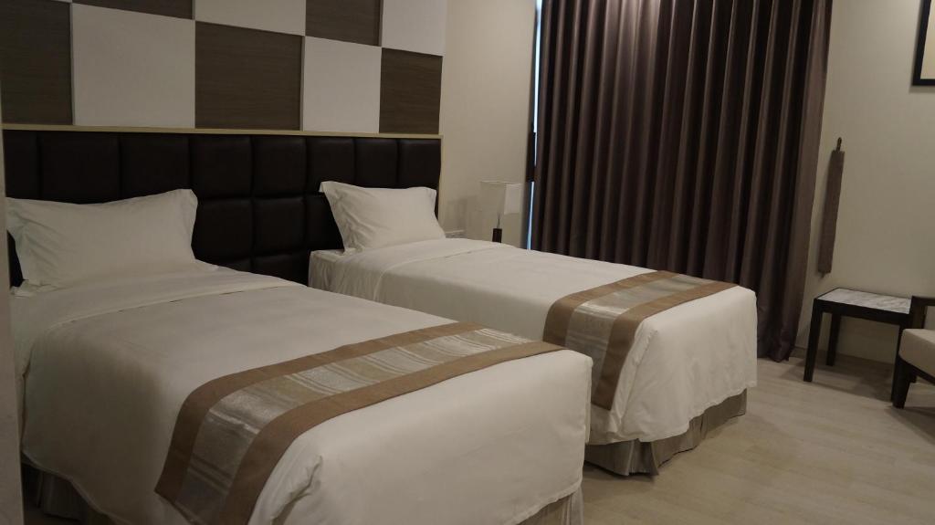 Postel nebo postele na pokoji v ubytování Hotel Parami