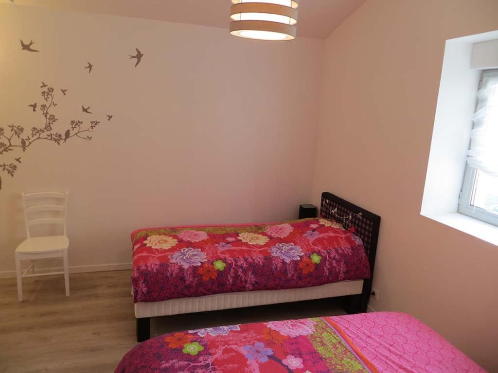 Postel nebo postele na pokoji v ubytování Les Studios-Hôtel de Sommières