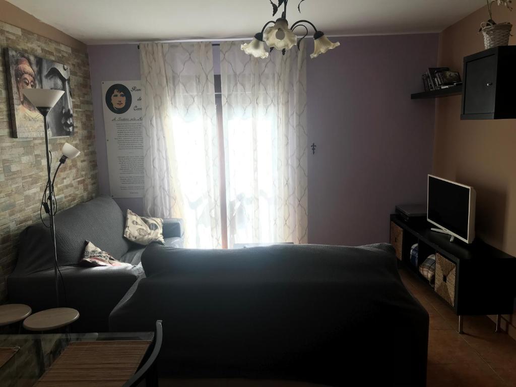 Televízia a/alebo spoločenská miestnosť v ubytovaní Casa Louro