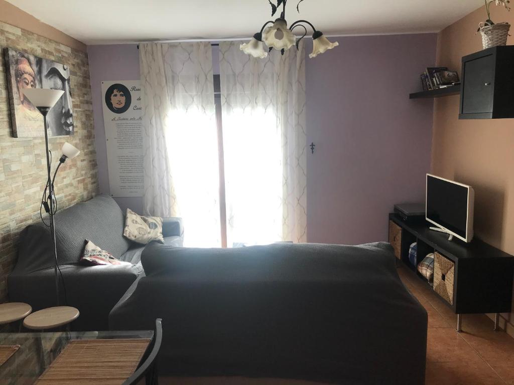 Televízia a/alebo spoločenská miestnosť v ubytovaní Casa Louro