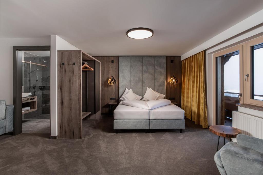 Voodi või voodid majutusasutuse Hotel Das Kohlmais toas