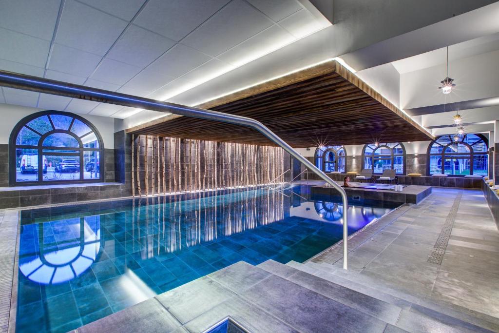 a swimming pool in a building with a swimming pool at California in Chamonix-Mont-Blanc