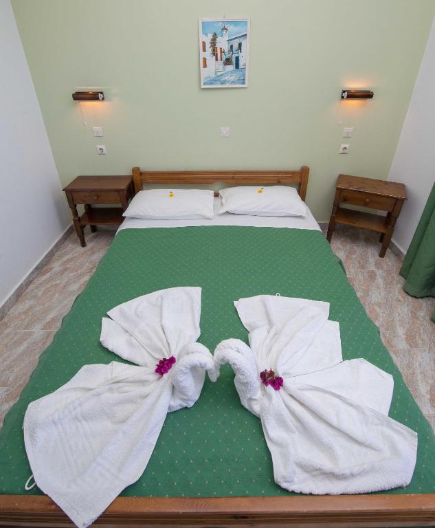 Postel nebo postele na pokoji v ubytování Hotel Eleni Anagros