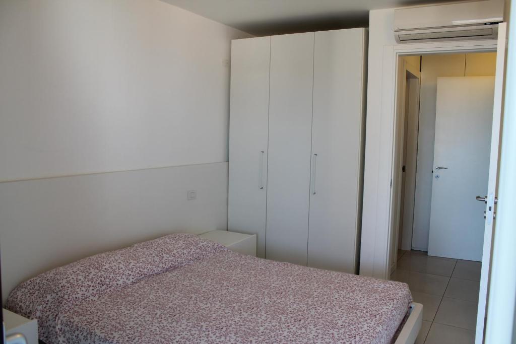 Tempat tidur dalam kamar di Appartamento Tiziano