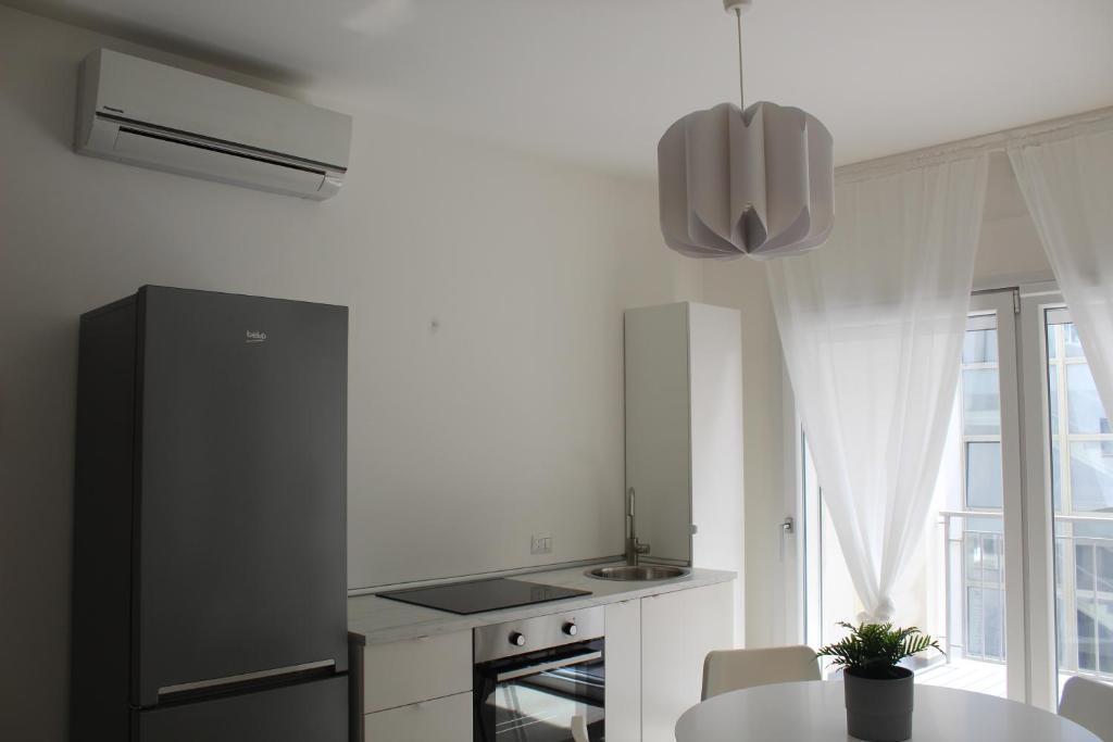 Kuchyňa alebo kuchynka v ubytovaní Virgilio 82 - Penthouse With Terrace