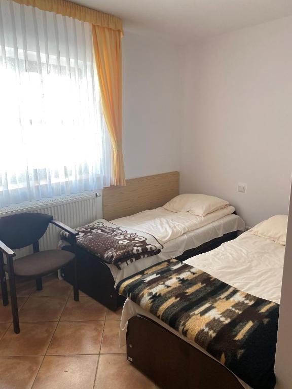 Postel nebo postele na pokoji v ubytování Ośrodek Wrzosowa Góra - pokoje