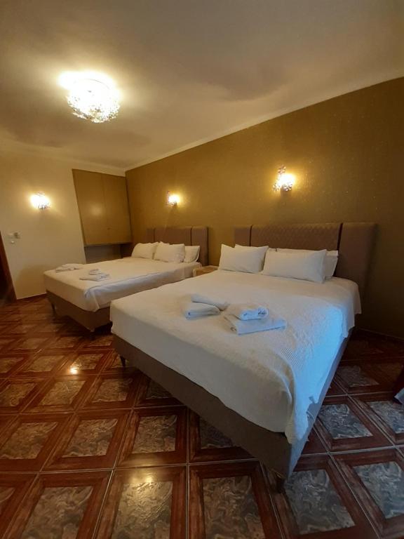 Postel nebo postele na pokoji v ubytování Hotel Astoria