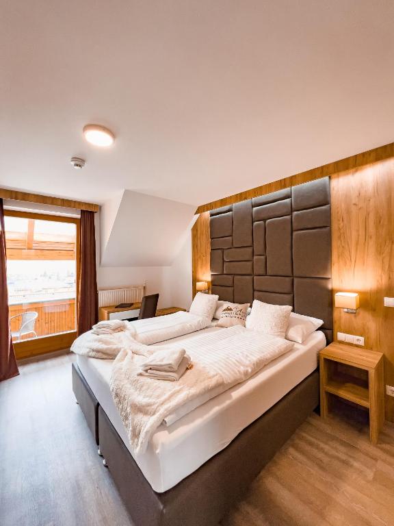 Postel nebo postele na pokoji v ubytování Sylpaulerhof Aparthotel