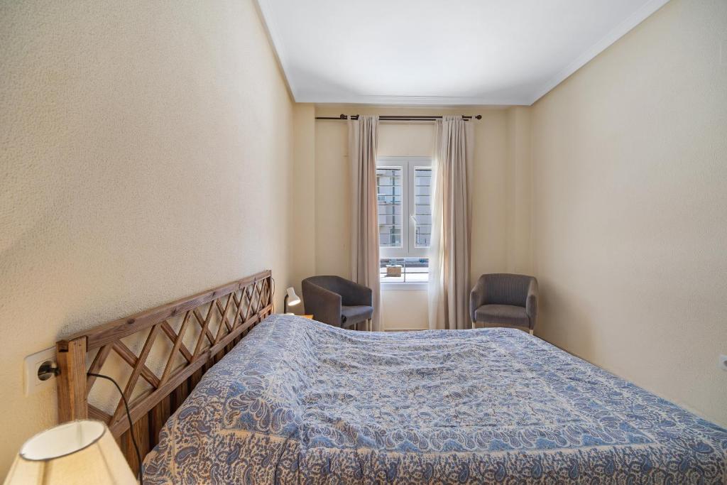 Łóżko lub łóżka w pokoju w obiekcie Apartamento Colibri