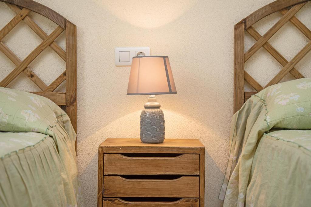Łóżko lub łóżka w pokoju w obiekcie Apartamento Colibri