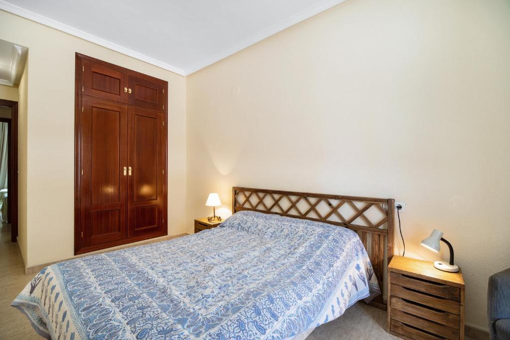 Łóżko lub łóżka w pokoju w obiekcie Apartamento Colibri