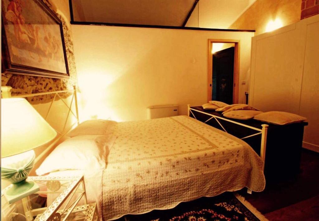 Postel nebo postele na pokoji v ubytování IL PICCOLO PARADISO