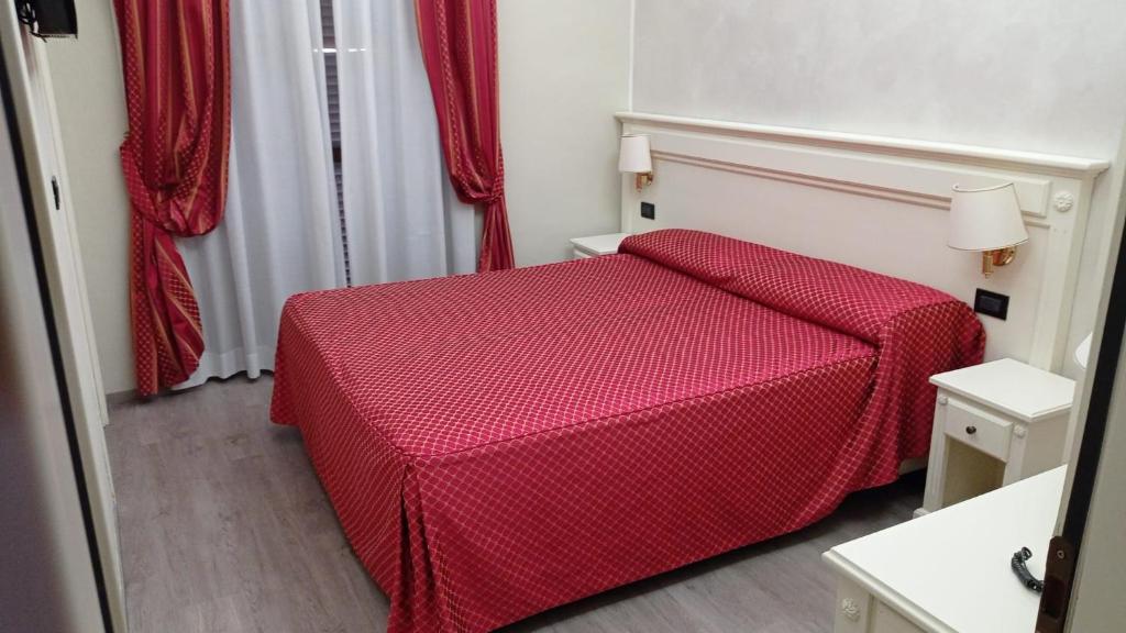 Postel nebo postele na pokoji v ubytování Hotel Galimberti