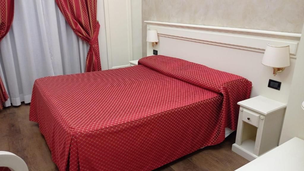 Postel nebo postele na pokoji v ubytování Hotel Galimberti
