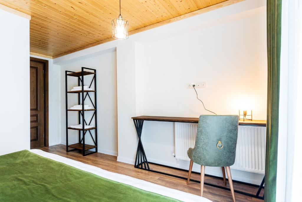 Postel nebo postele na pokoji v ubytování Hotel Chatini Mestia