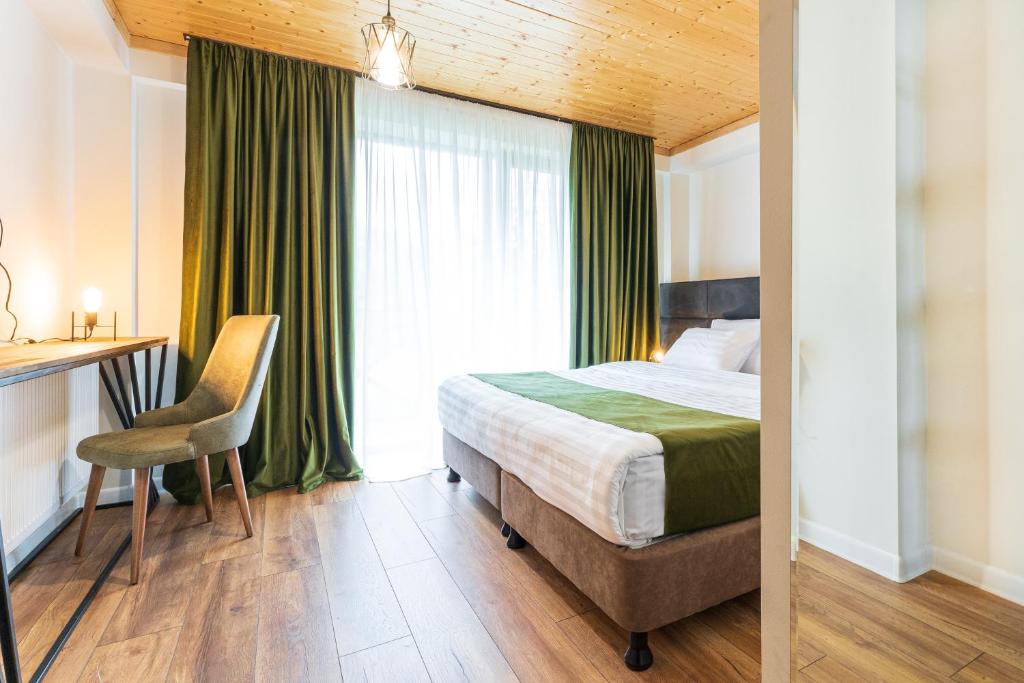 Postel nebo postele na pokoji v ubytování Hotel Chatini Mestia