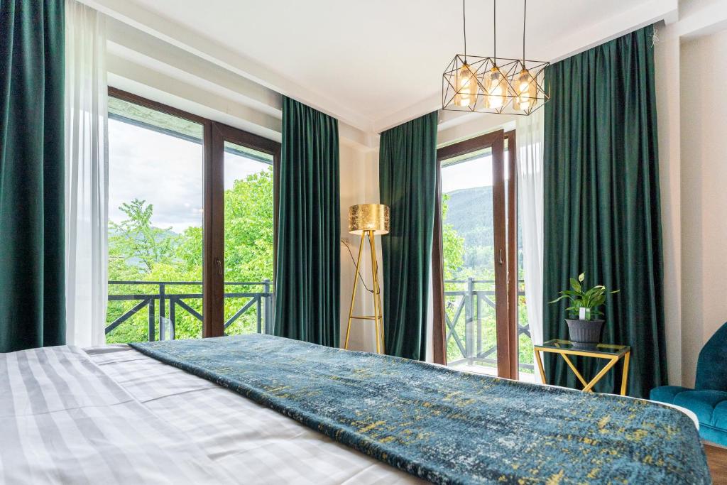 Postel nebo postele na pokoji v ubytování Hotel Chatini Mestia