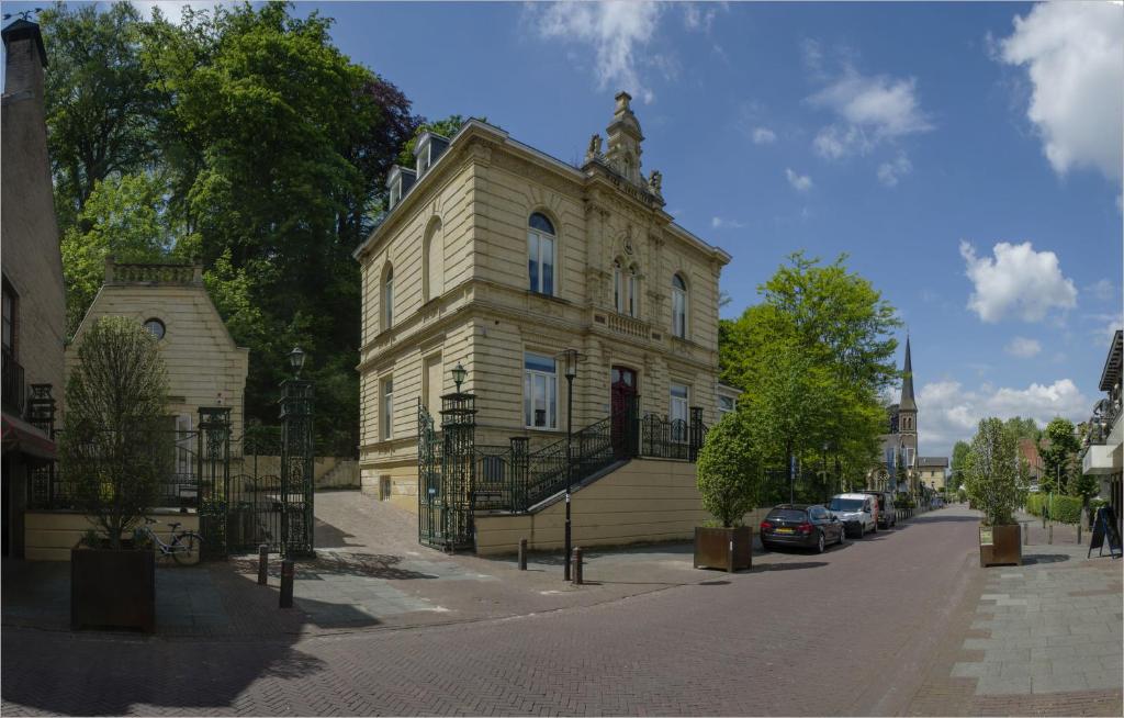 a large building with a clock on the side of it at Villa Valkenburg in Valkenburg