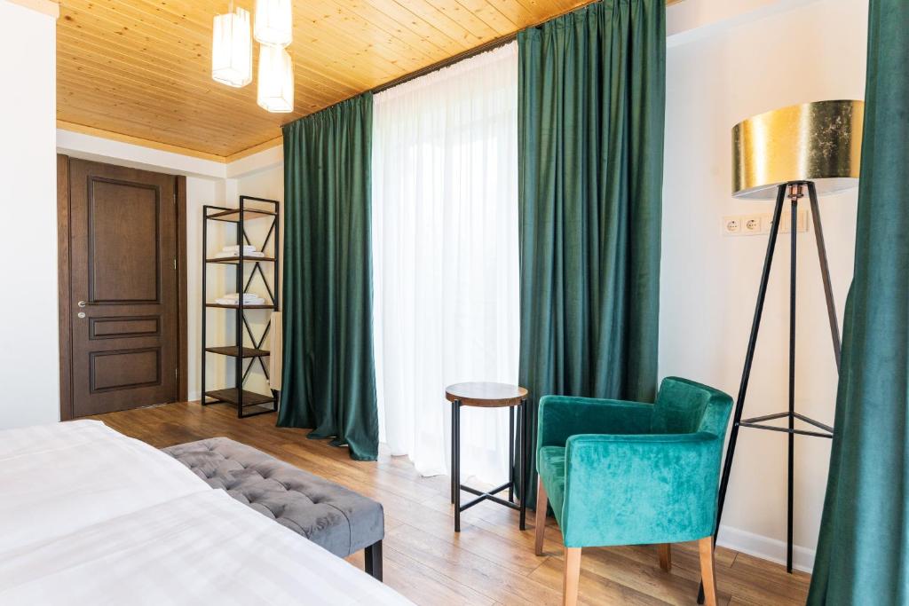 Postel nebo postele na pokoji v ubytování Hotel Chatini Mestia