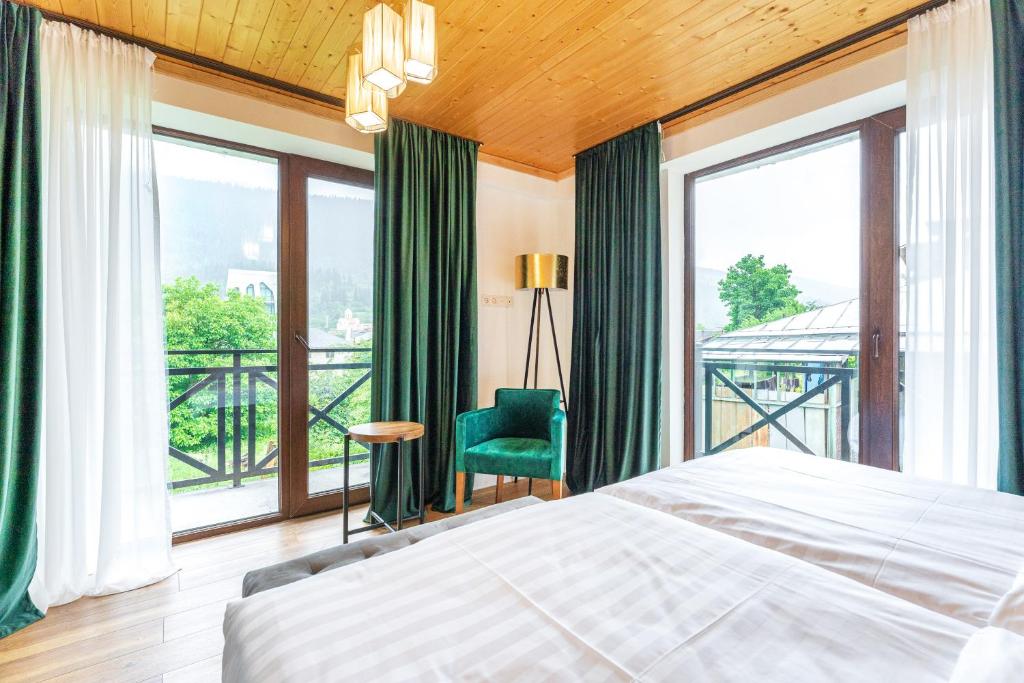 Postel nebo postele na pokoji v ubytování Hotel Chatini Mestia