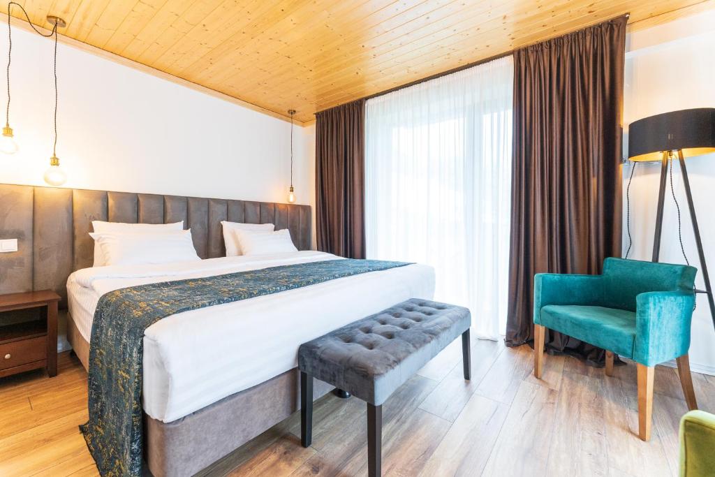 Postel nebo postele na pokoji v ubytování Hotel Chatini Mestia
