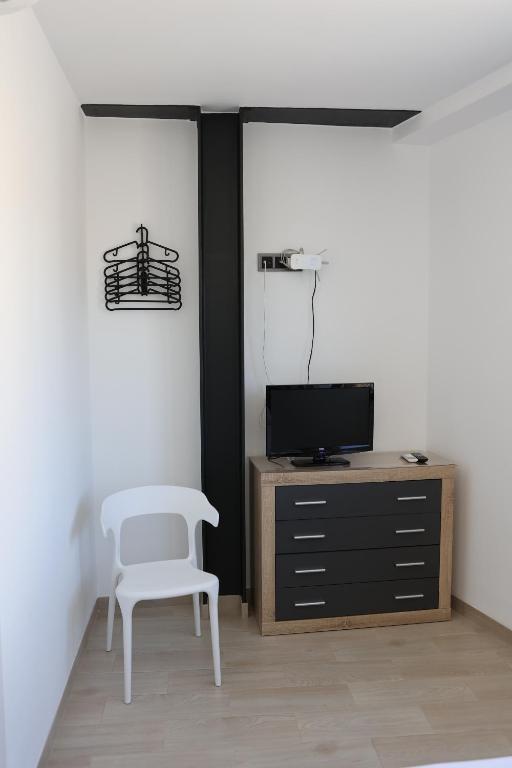TV a/nebo společenská místnost v ubytování Ca ma mare