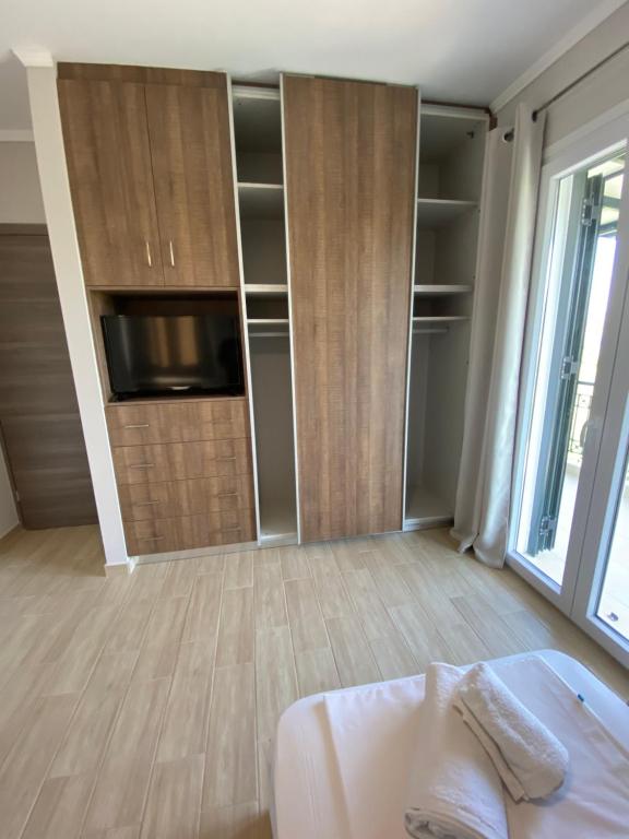 Postel nebo postele na pokoji v ubytování Tasos Cozy House