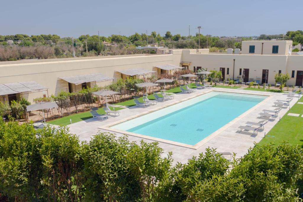 an overhead view of the pool at a resort at Delle Rose, Hotel & Restaurant in Torre Vado