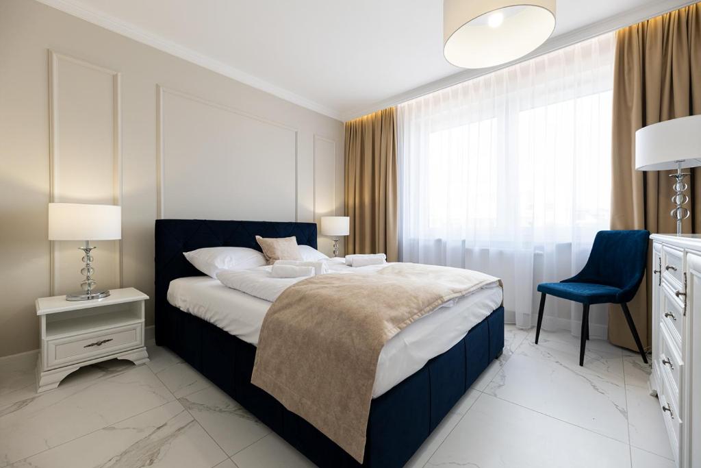 Łóżko lub łóżka w pokoju w obiekcie Apartamenty Prestige Mielno-Uniescie