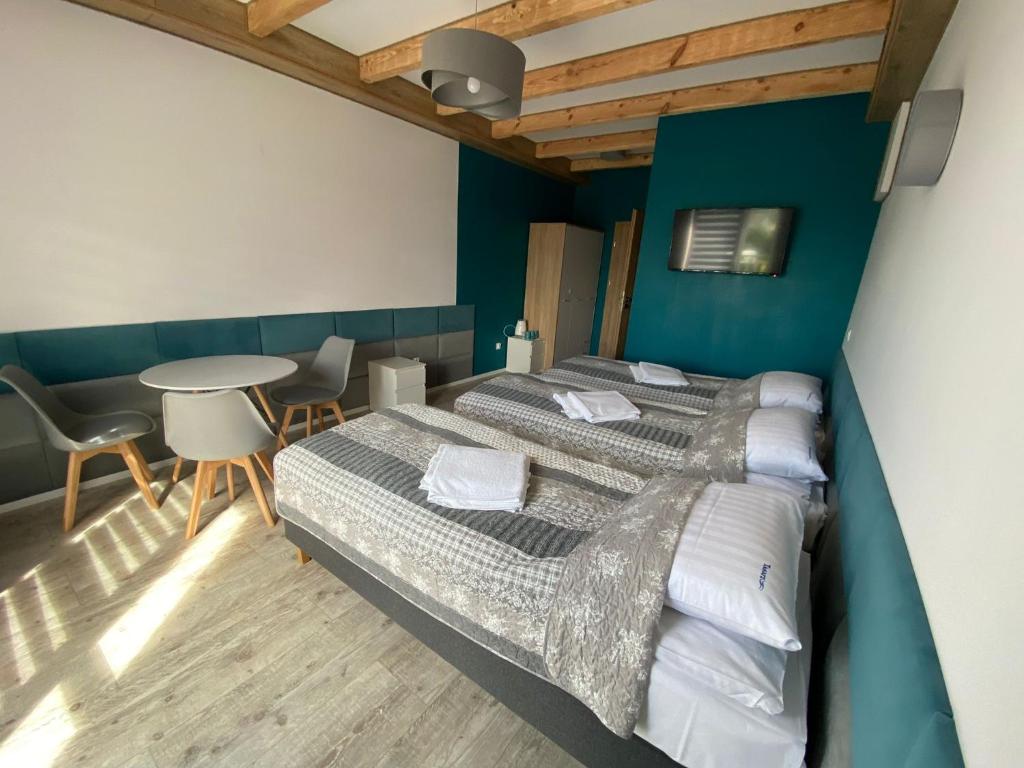 Posteľ alebo postele v izbe v ubytovaní Tasarz Spa Ośrodek Wczasowy