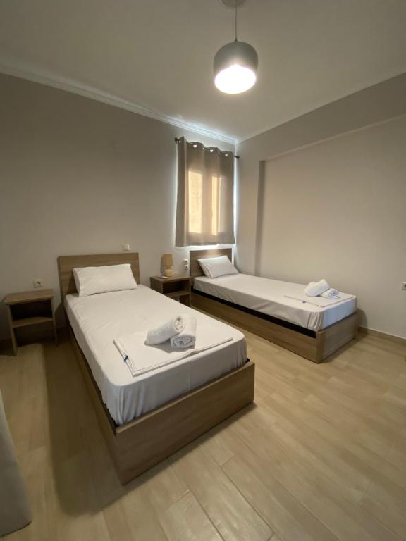Postel nebo postele na pokoji v ubytování Tasos Cozy House