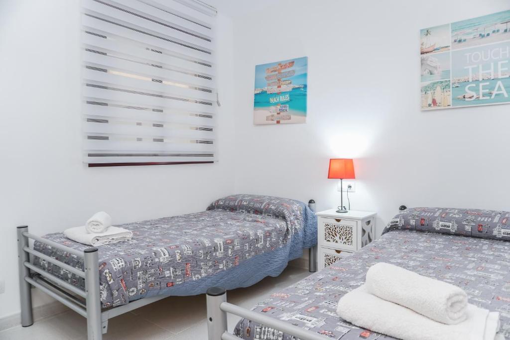 Postel nebo postele na pokoji v ubytování Cambrils Beach & Sea