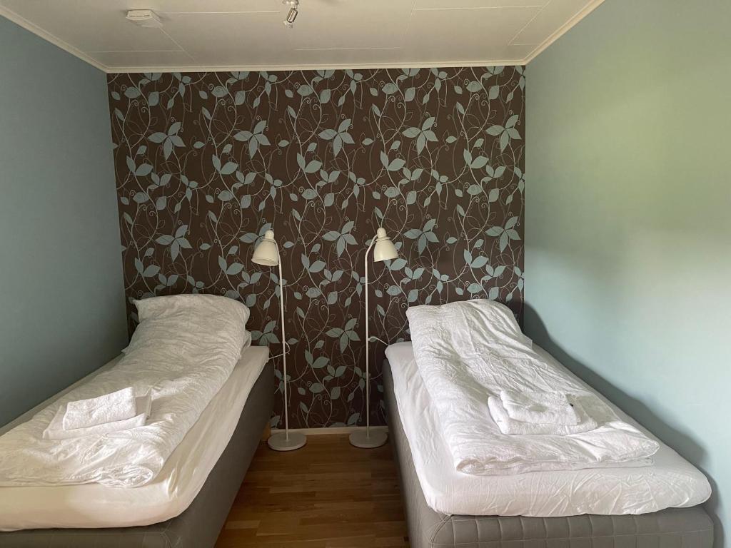 Postel nebo postele na pokoji v ubytování På Taket Overnatting