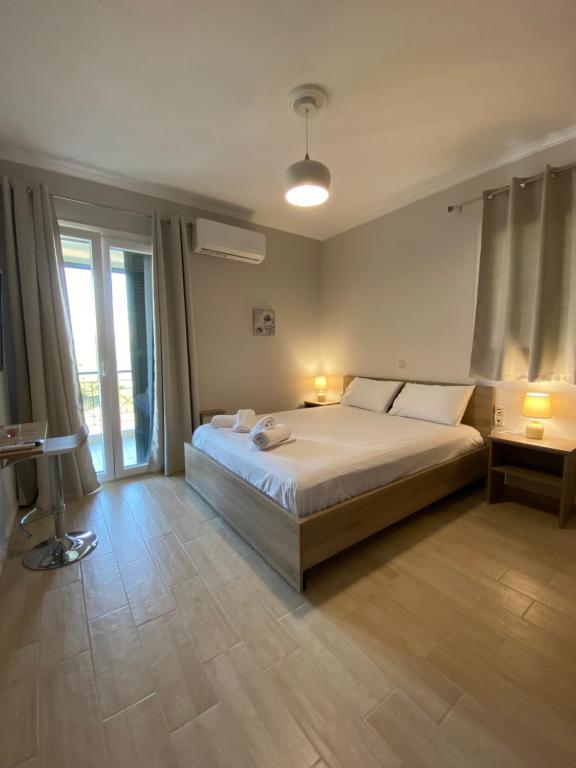 Postel nebo postele na pokoji v ubytování Tasos Cozy House