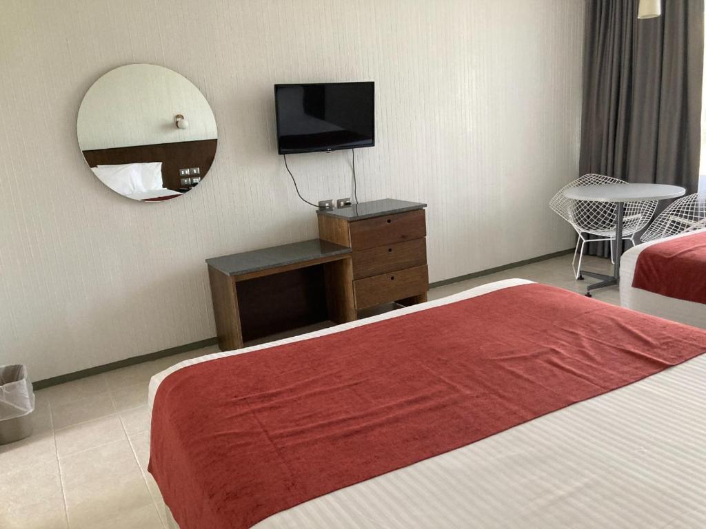 Postel nebo postele na pokoji v ubytování Hotel Y Parque Acuático La Caldera