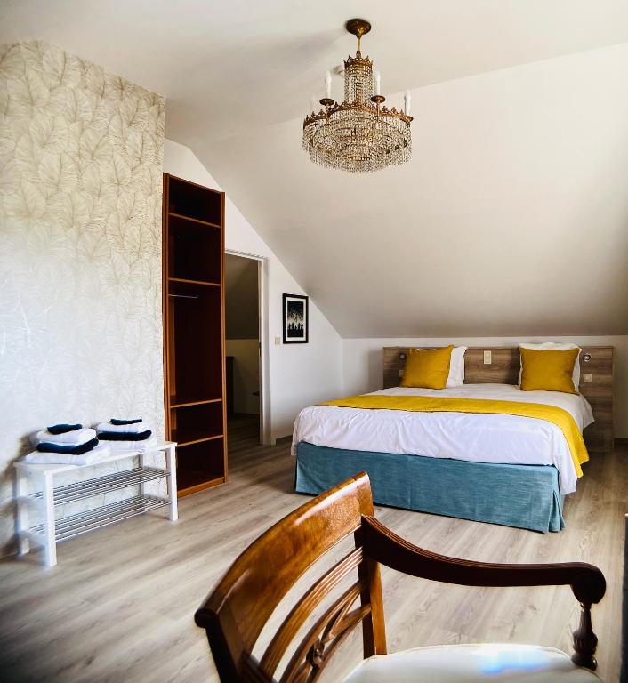 Postel nebo postele na pokoji v ubytování B&B l'Aigrin