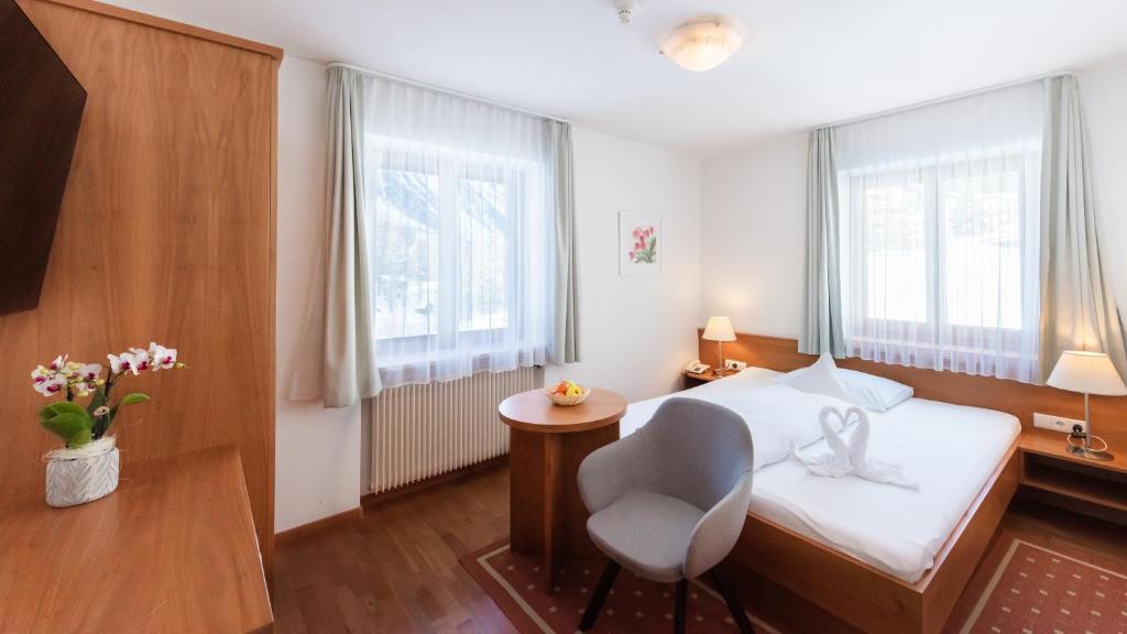Postel nebo postele na pokoji v ubytování Hotel Julius Payer