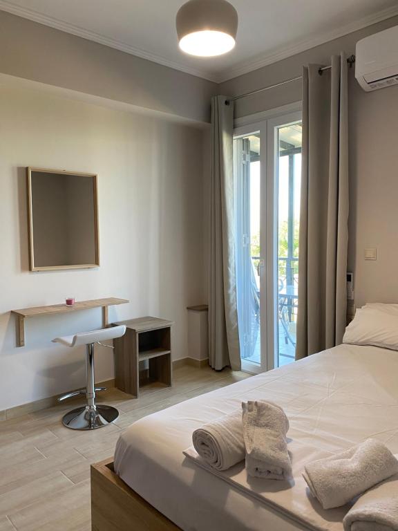 Postel nebo postele na pokoji v ubytování Tasos Cozy House