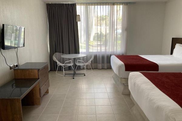 Postel nebo postele na pokoji v ubytování Hotel Y Parque Acuático La Caldera