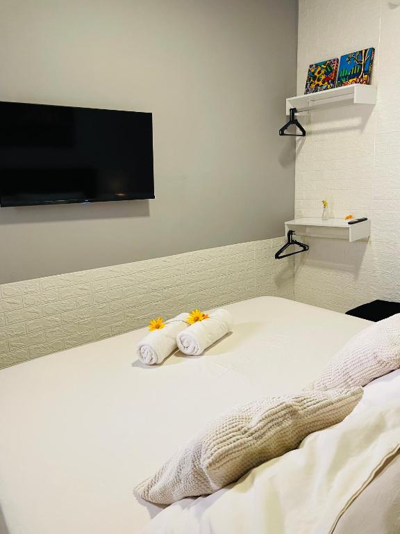Postel nebo postele na pokoji v ubytování Hostel Ilha do Amor